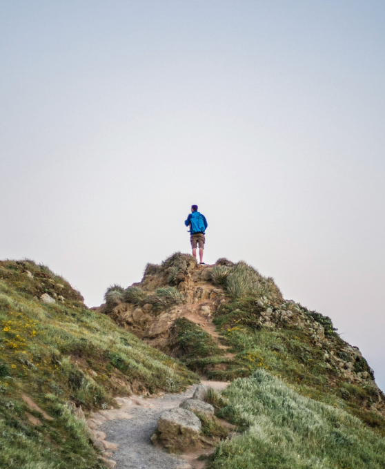 Standing on a mountain summit — Pelagus adventure therapy