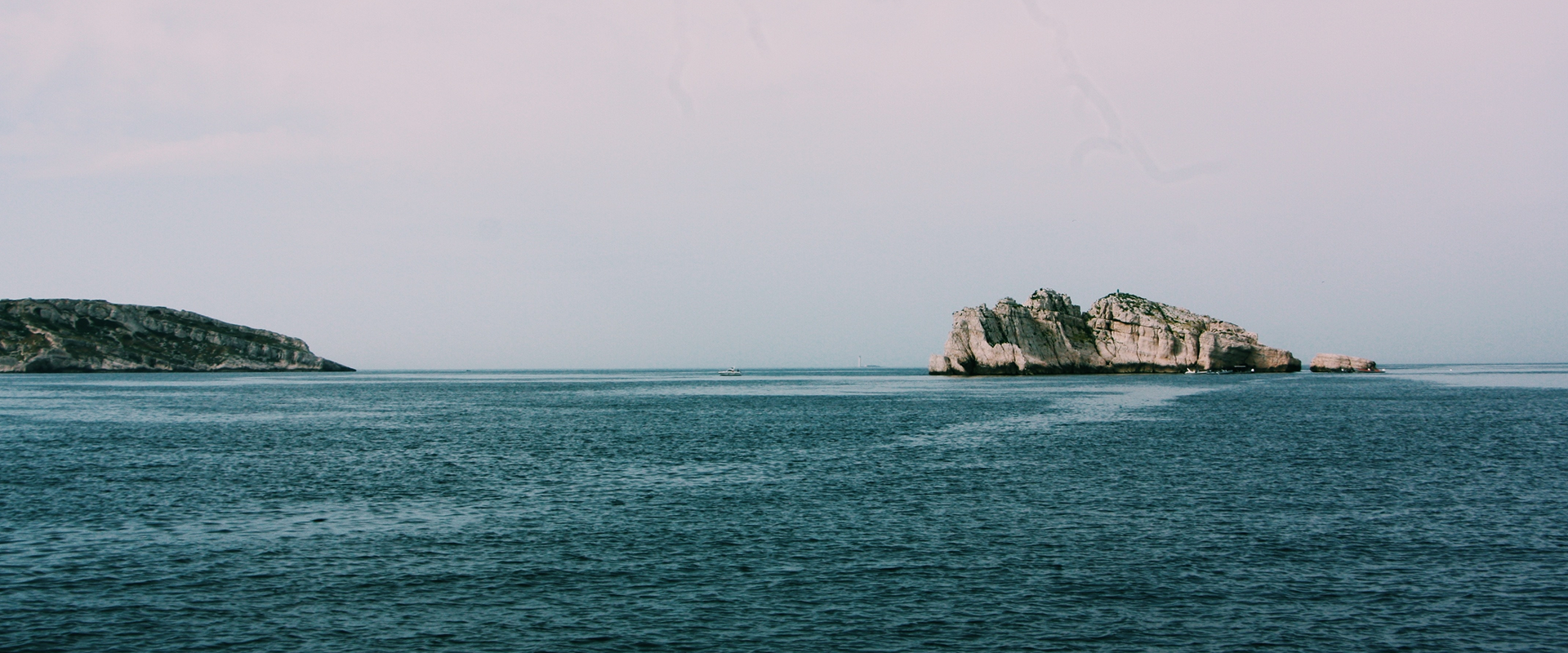 Atlantic sea cliffs and open water under a cloudy sky on the west coast of Ireland