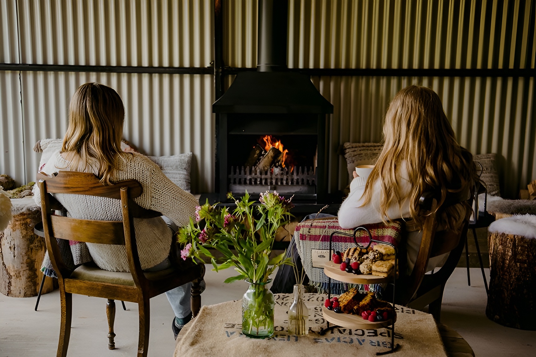 Two women relaxing by the fire — Deerstone women's retreat